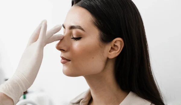 11-young-female-nose-being-evaluated-rhinoplasty